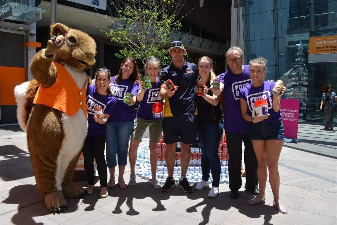 Foodbank WA team and supporters collecting cans for Christmas