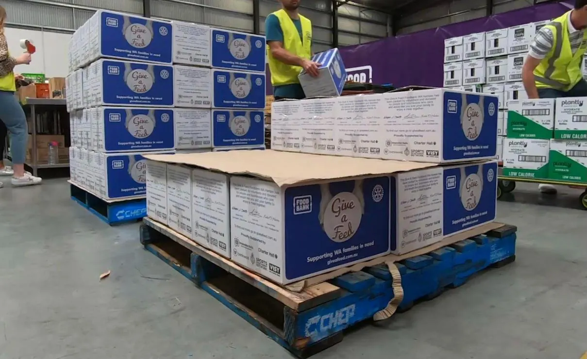 Pallets of packed Give A Feed hampers at Foodbank WA, ready to go to WA families